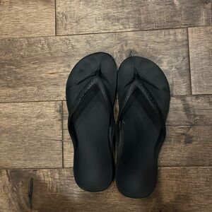 Archie’s Black Flip Flops